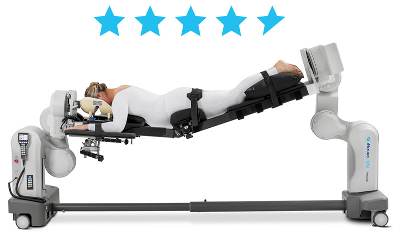 Patient laying face-down on a Mizuho OSI ProneView Protective Helmet System that's attached to the Mizuho ProAxis Spinal Surgery Table with her legs lifted. Hovering over are 4.8 of the five blue stars filled in.